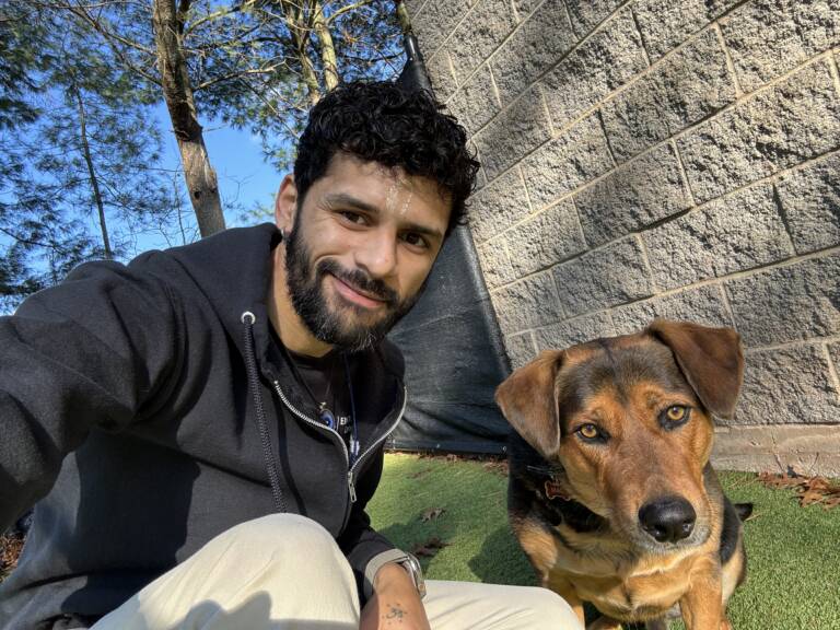 Ivan Rios with Mac, a shepherd mix, at Elite Training Centers